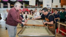 H.E. Mr. Karlis Eihenbaums,ambassador of Latvia to China, tries his hand at the traditional craft of Xuan papermaking.
